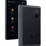 Keystone Wallet device showing a black exterior with a digital screen displaying cryptocurrency options.